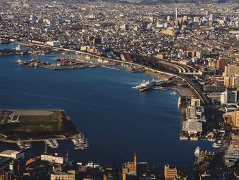 High angle view of river and buildings in city