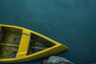 High angle view of yellow boat moored at lake