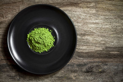 High angle view of green bowl on table