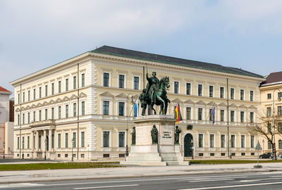 Statue of historic building against sky