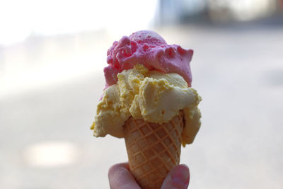 Hand holding ice cream cone