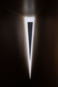 Close-up of illuminated lamp against black background