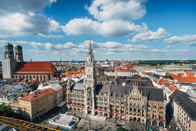 High angle view of city against cloudy sky