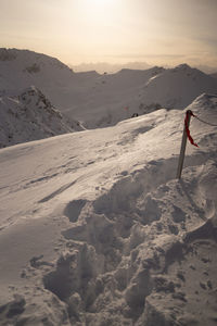Rear view of man walking on snow