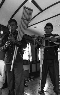 Musicians performing in train