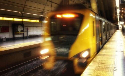 Blurred motion of train at railroad station at night