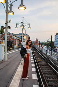 Full length of woman on railroad station platform