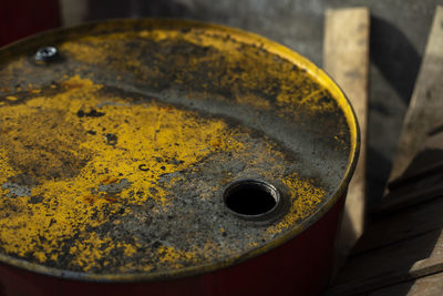 Fuel tank and rust. steel barrel on street. hole for receiving fuel. nin-free container.