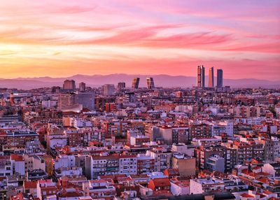 High angle view of buildings against sky during sunset