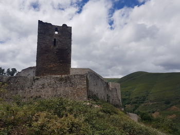 Low angle view of old building against sky