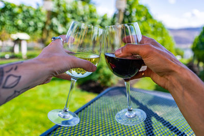 Cropped image of hand holding beer glass