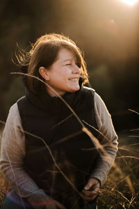 Beautiful portrait of a  stylish woman on a sunny day in autumn