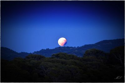 View of moon against blue sky