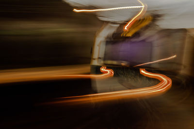 High angle view of light trails on road at night