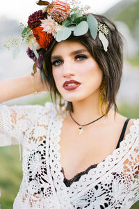 Portrait of young woman wearing flowers