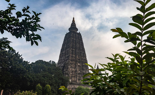 Mahabodhi temple buddhist stupas isolated with bright sky and unique prospective