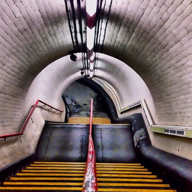 indoors, ceiling, steps, built structure, architecture, steps and staircases, railing, the way forward, staircase, arch, no people, high angle view, diminishing perspective, wood - material, in a row, absence, empty, transportation, low angle view, wall - building feature