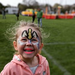 Portrait of smiling girl with painted face during event