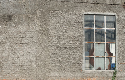 Full frame shot of window on wall of building