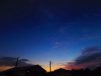 Silhouette landscape against sky at sunset