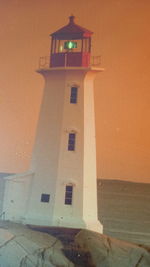 Low angle view of building against sky during sunset