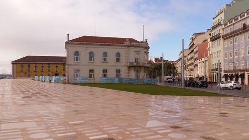 View of buildings in city against sky