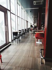 Empty chairs and tables in restaurant