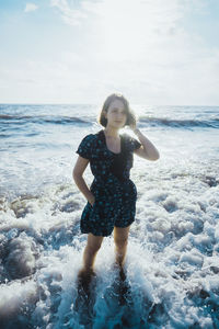 Full length of young woman on beach