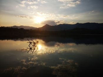 Scenic view of lake against sky during sunset