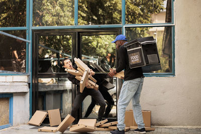 Side view of man using mobile phone