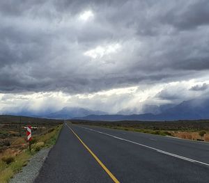 Road against cloudy sky