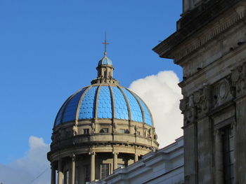 Low angle view of building against blue sky