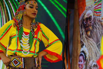 Full length of young woman looking away