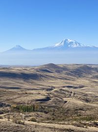 Scenic view of snowcapped mountains against sky. two peaks of ararat. 