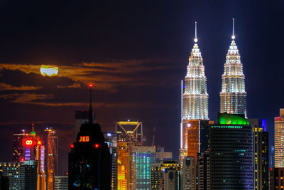 Illuminated buildings in city at night