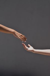 Human hand against gray background