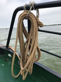 Close-up of rope tied to railing