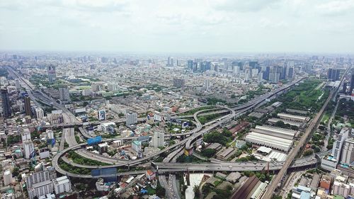 High angle view of modern buildings in city against sky