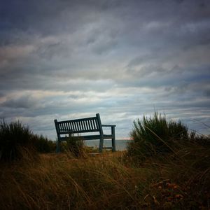 Lifeguard hut on beach against sky