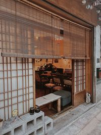 Empty chairs and table in building