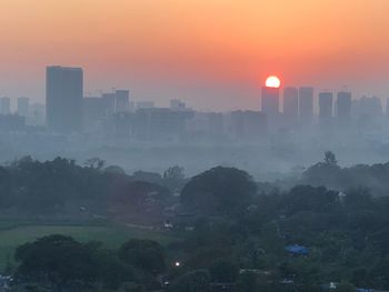 Cityscape against sky during sunset