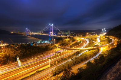 High angle view of light trails on road against sky at night