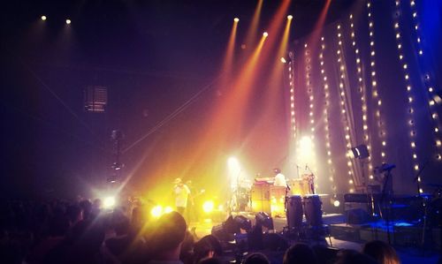 People enjoying music concert at night