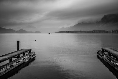 Pier over lake against sky