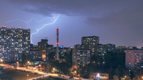 Panoramic shot of illuminated city against sky at night