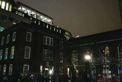 Illuminated buildings in city at night