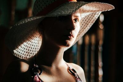 Portrait of young woman in hat