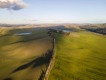 Scenic view of agricultural landscape against sky