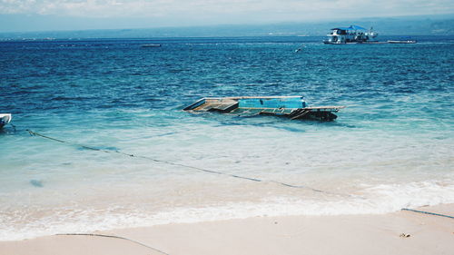 Damaged boat at sea shore