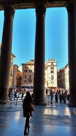 People in town square against clear sky